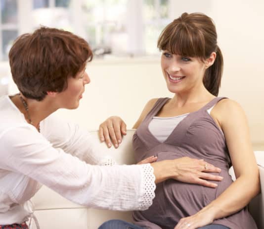 Pregnant woman with midwife